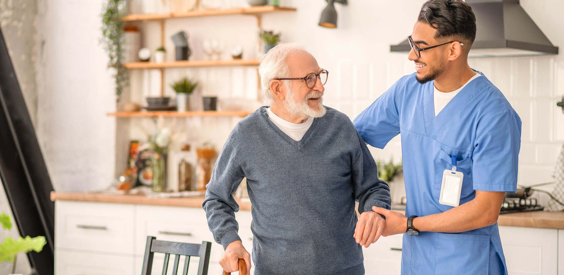 male caregiver assisting the senior